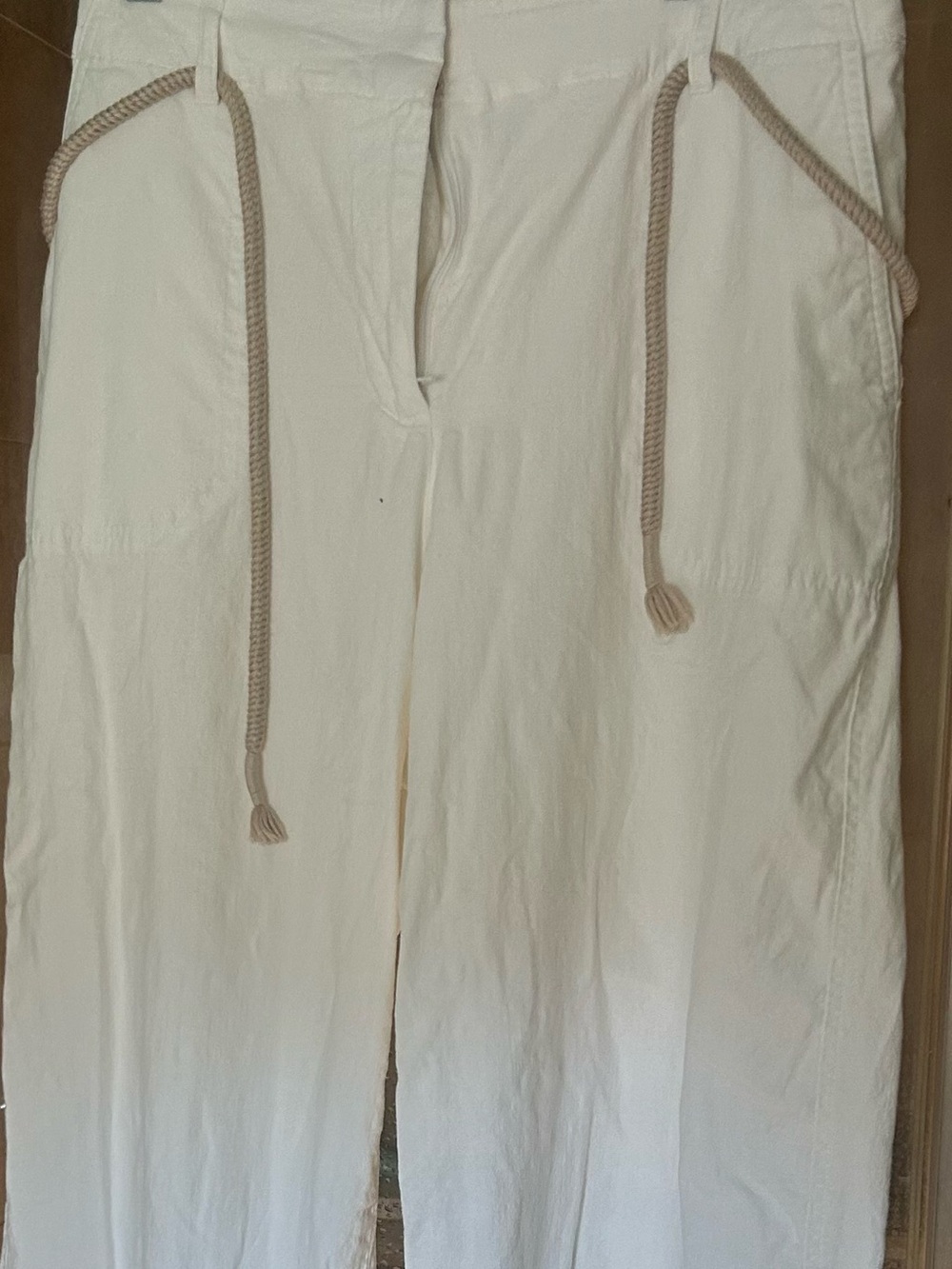 White crops with decorative rope belt.  Worn once